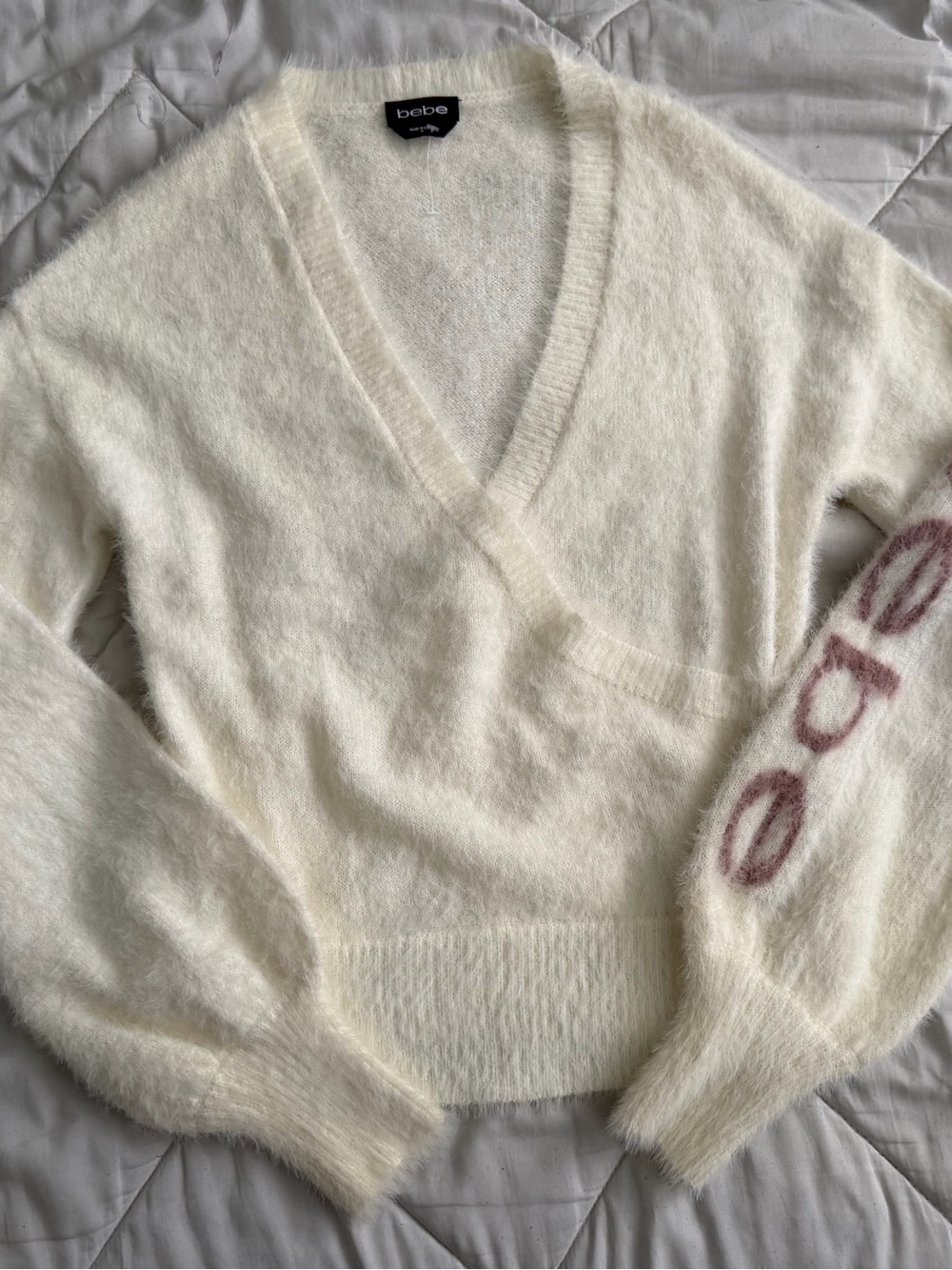 bebe Ivory Fuzzy V-Neck Sweater with Logo Sleeve